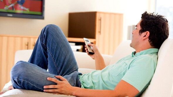The man looks at television
